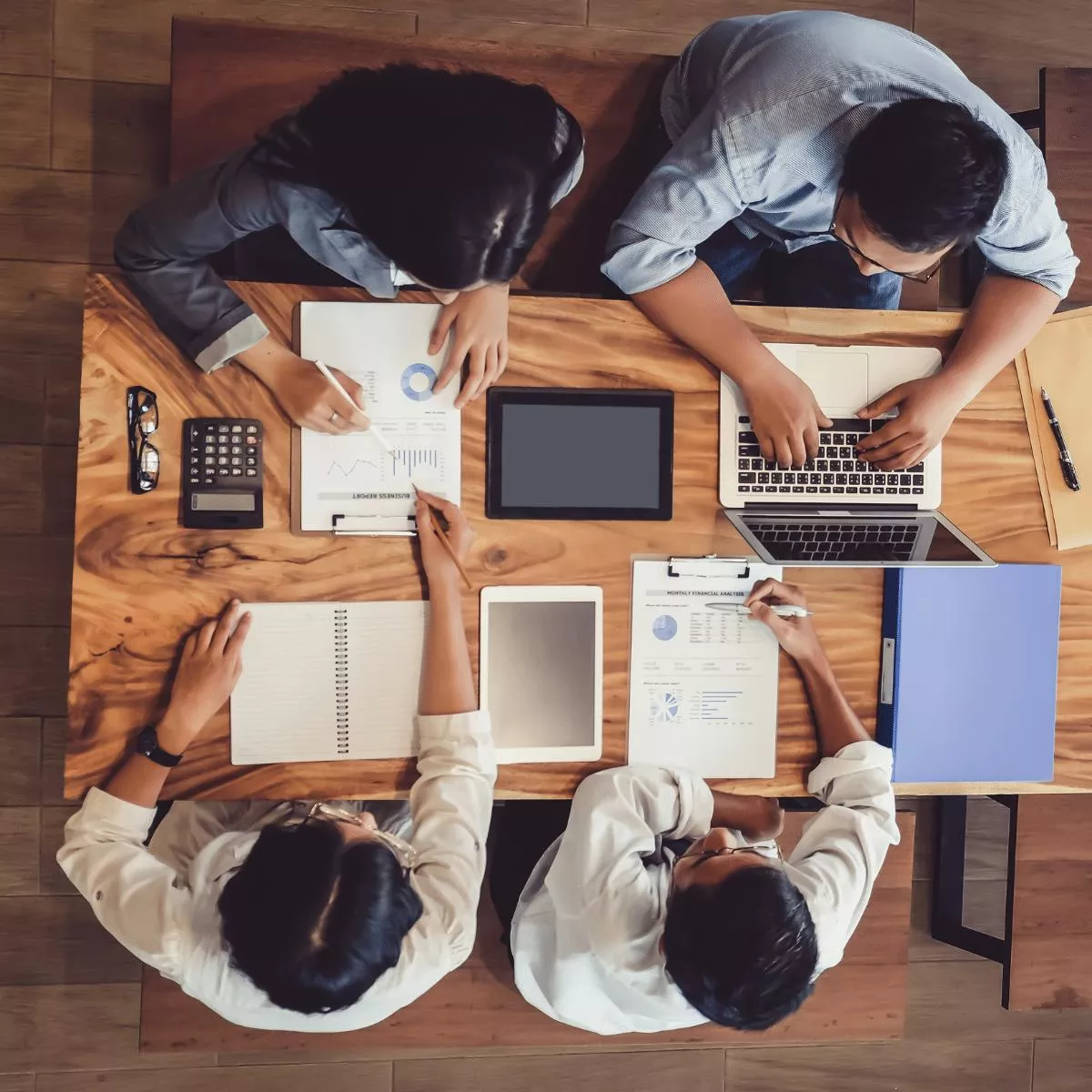 View from the top of an office with 4 professional consultants doing audits